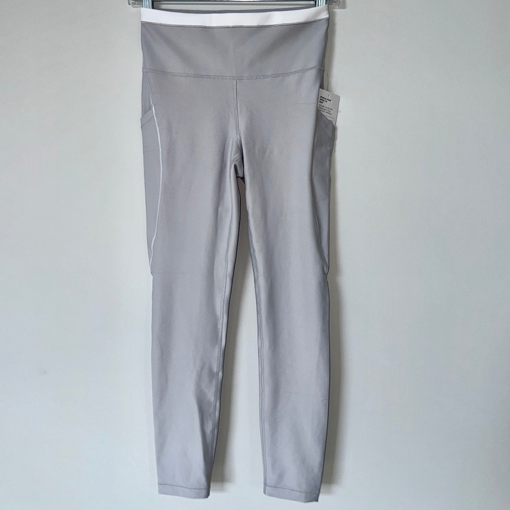 ATHLETA interval stash high rise tipped 7/8 leg . NEW w/tags . S.TALL